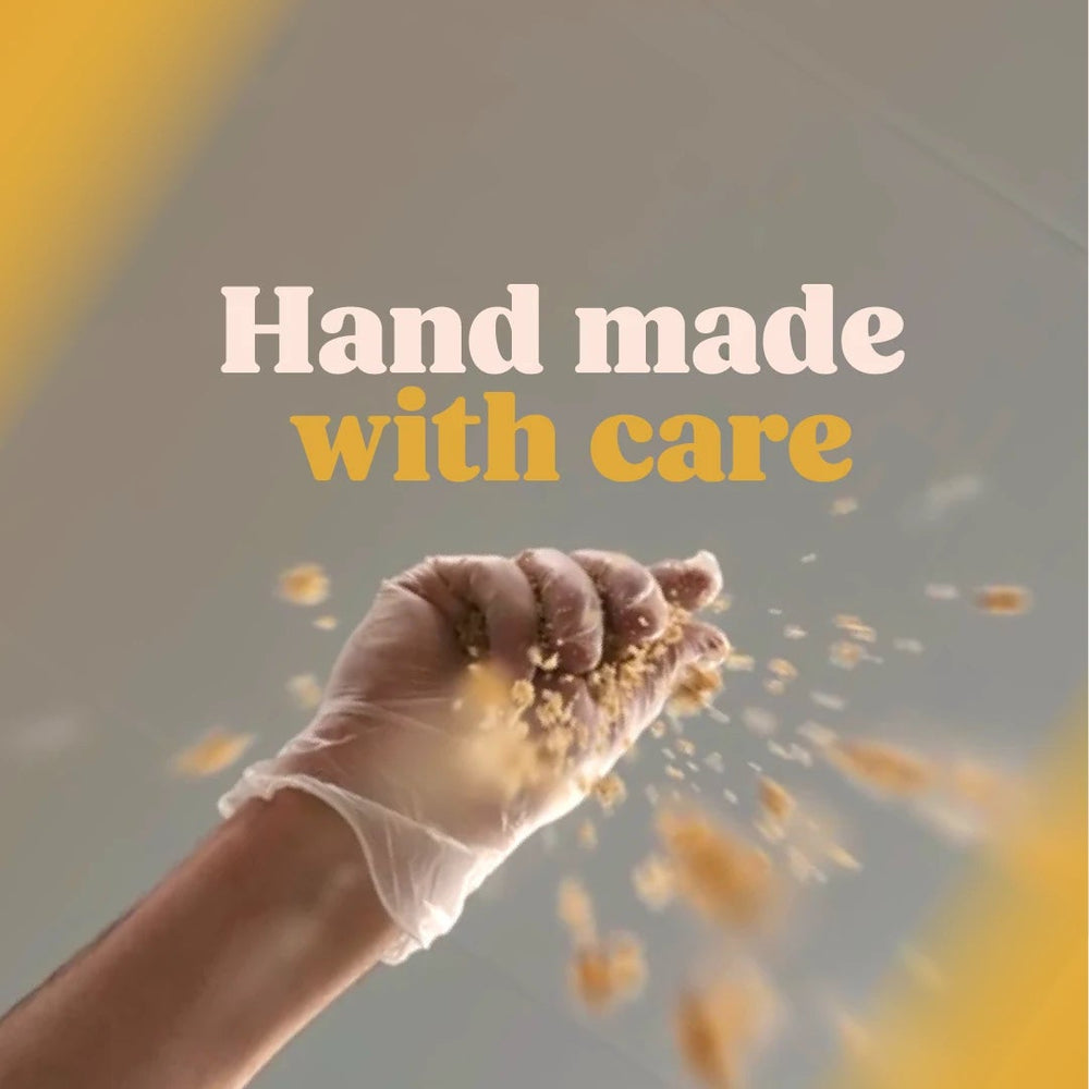 
                  
                    Picture of hand dropping natural cheesecake crumb
                  
                